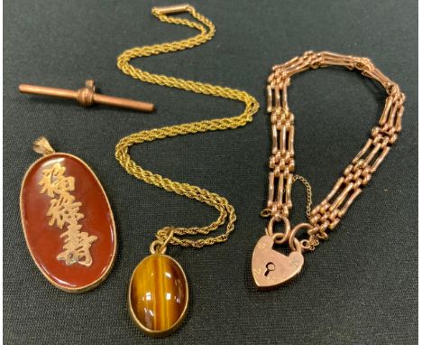 A 9ct rose gold gate bracelet, padlock clasp, stamped 9ct;  9ct gold t bar;  gold coloured metal mounted tigers eye pendant n