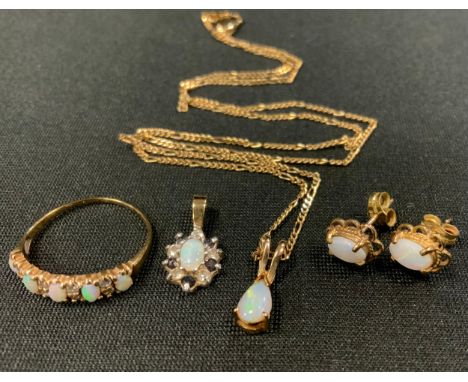 A 9ct gold opal and diamond line ring, size K; pair of 9ct gold mounted oval opal earrings;  similar pendant etc, part unmark