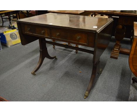 A reproduction mahogany sofa table.