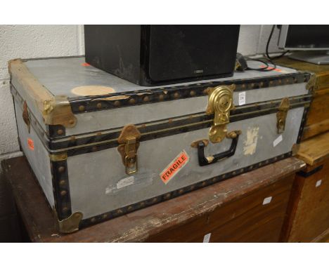 A metal storage trunk.