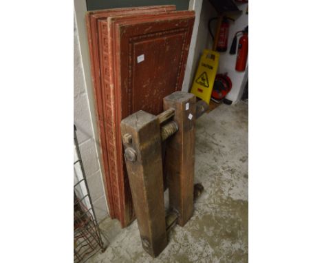 A large carpenters wooden vice and another item.