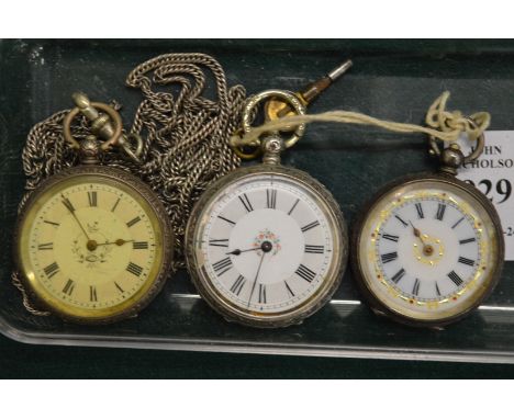 Three ladies silver and enamel fob watches.