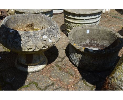 A reconstituted stone basket weave style garden planter together with a pedestal planter.