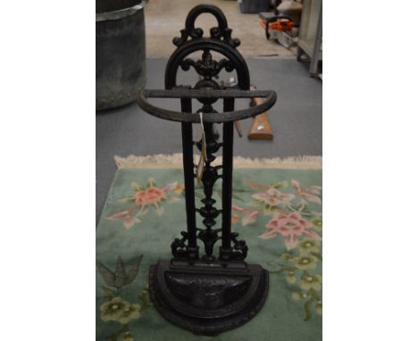 A small cast iron stick stand.