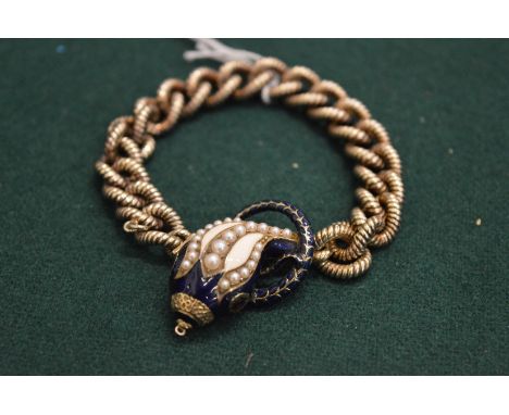 A good silver bracelet with snake design, executed in enamel, pearl and ruby.