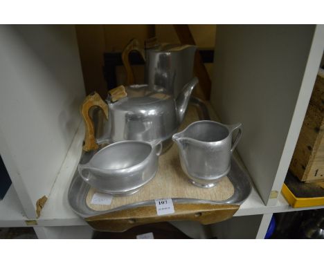 A Picquot Ware tea service comprising, tea pot, hot water jug, milk jug, sugar basin and tray.