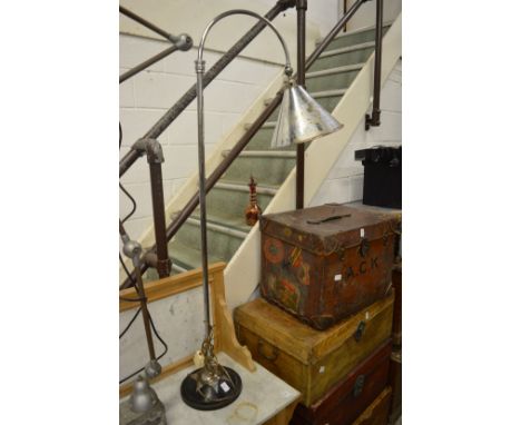 A chrome floor standing adjustable lamp.