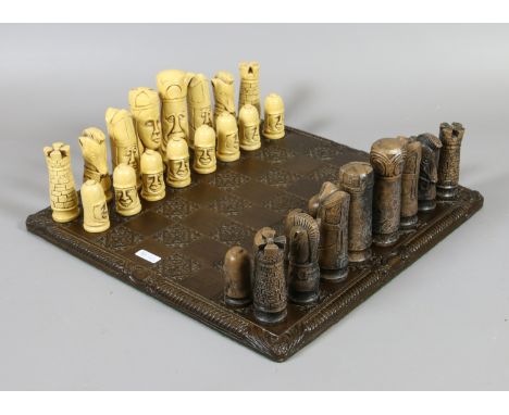 A faux ivory chess set and board.