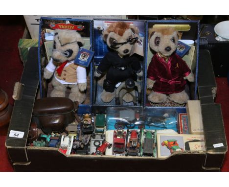 A box of childrens toys to include meerkats, Diecast model cars and vans, a cased camera and a stylaphone.