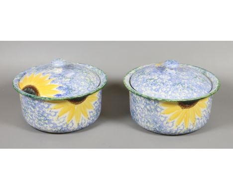 A pair of Poole pottery casserole dishes with covers. Decorated in the Sunflower pattern inspired by Vincent Can Gogh.