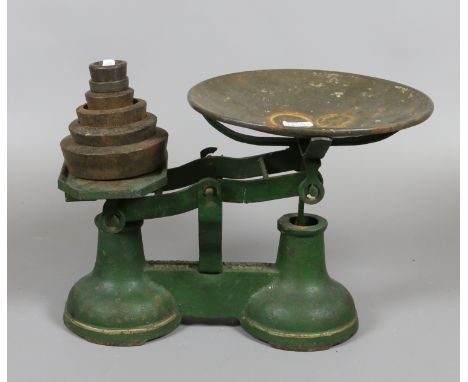 A set of cold painted scales including graduated set of weights.