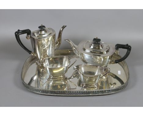 A 19th century silver plated four part tea service on pierced serving tray.