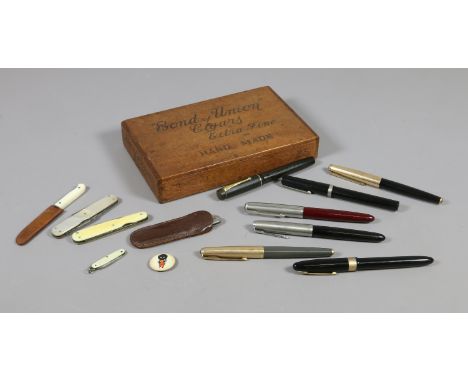 A Bond of Union Cigars box and contents; vintage fountain pens including Parker, pen knives and a golly badge.