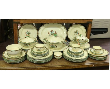 An Art Deco Mintons tea/dinner service handpainted with coloured enamels including plates, side plates, tureens, cups, saucer
