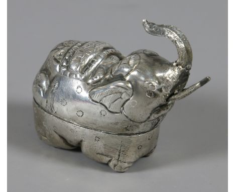 A white metal trinket box in the form of an elephant.