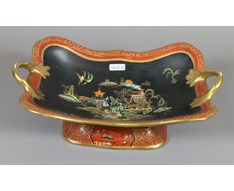 A Carltonware centrepiece, black ground and decorated with a Chinese landscape.