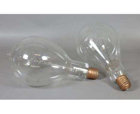 A vintage oversized 1500w screw fit filament light bulb by Cosmos and one similar (one AF).