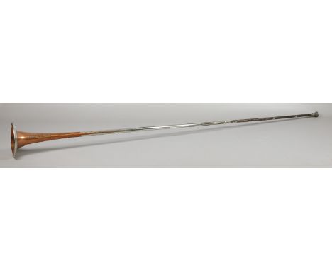A copper and silver plated hunting horn with inscription "Kohler & Sons makers 61 Victorian Street, Westminster (from Covent 
