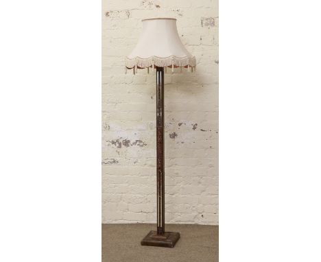 A square formed standard lamp with mirror decoration and shade.