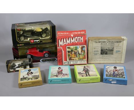 Three Diecast model cars to include MGTC, Mercedes Benz roadmaster, Lotus and a collection of jigsaws.