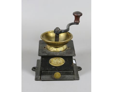 A Victorian cast iron and brass coffee grinder by J. & W. Findlay of Liverpool.