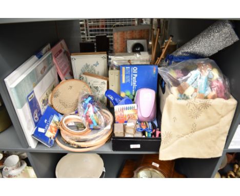 A large quantity of crafting items, to include pastel crayons, embroidery hoops, silks, paper punches and embroidery hats ect