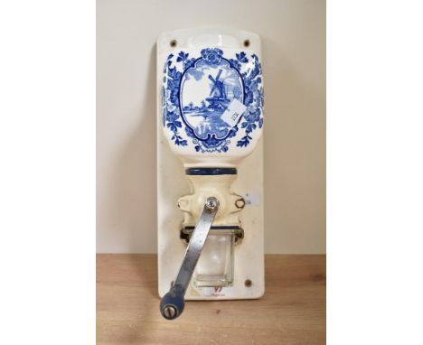 A 20th century hand cranked coffee grinder having glass hopper, h34cm