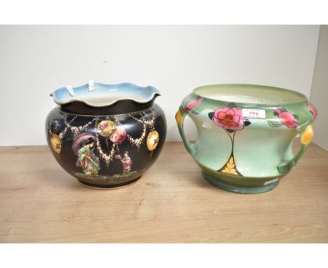 An oriental style jardinière having chinoiserie decoration on a black ground, h18cm, sold together with another jardinière in