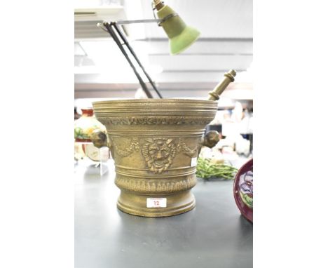 A large bronze pestle and mortar, decorated with Renaissance style relief decoration, h21cm