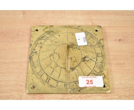 A brass sundial having Roman numerals, w12.5cm