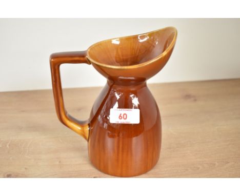Dr Christopher Dresser (1834 - 1904), A late 19th / early 20th century Linthorpe pottery jug, having shaped spout and handle,