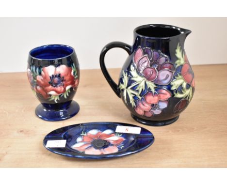 A Moorcroft pottery 'Anemone' pattern pitcher, having tubelined decoration, impressed and painted marks to base, h14.5cm, sol