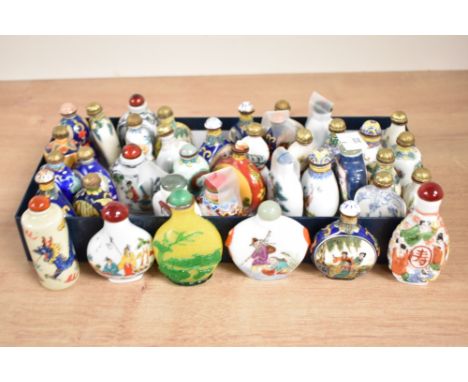 A quantity of Chinese snuff bottles decorated with various traditional scenes, to include landscape, dragon and Buddhist, (39