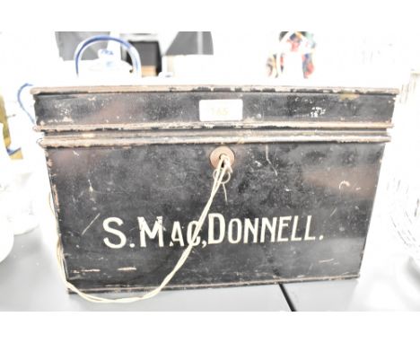 An early 20th century black metal deed box, inscribed reading 'S.MAC,DONNELL', h20cm, sold together with a Kodak flashlight, 