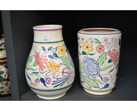 A Poole pottery vase of baluster form, having floral decoration, h25cm, sold together with another Poole pottery vase, (2)