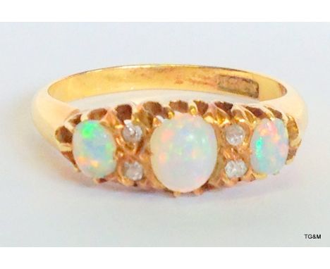 An 18ct gold and opal ring size O