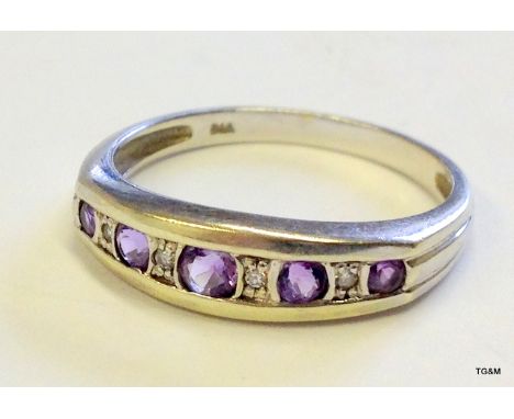 A 9ct gold amethyst  and diamond ring size 0