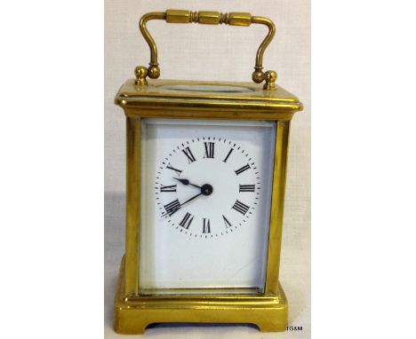 A brass carriage clock with French movement and key