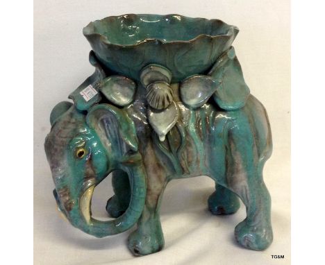 An Oriental glazed pottery model of an Elephant flower planter