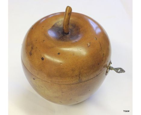 A fruitwood tea caddy in the shape of and apple