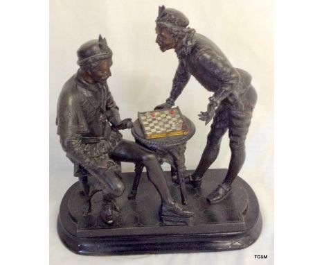 A large spelter model of two men playing chess, 30cm high
