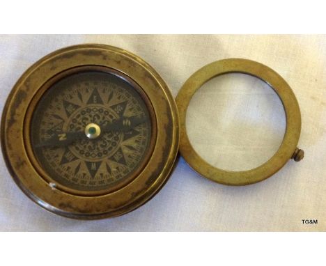 A Compass with magnifying glass
