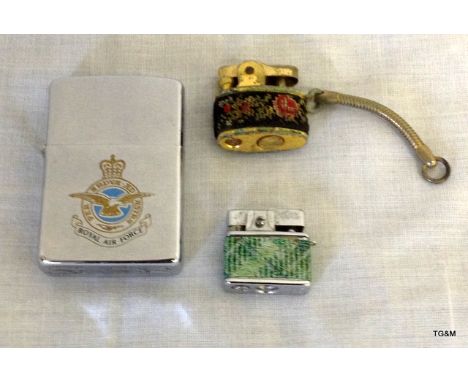 An R.A.F Zippo lighter and 2 other cigarette lighters 