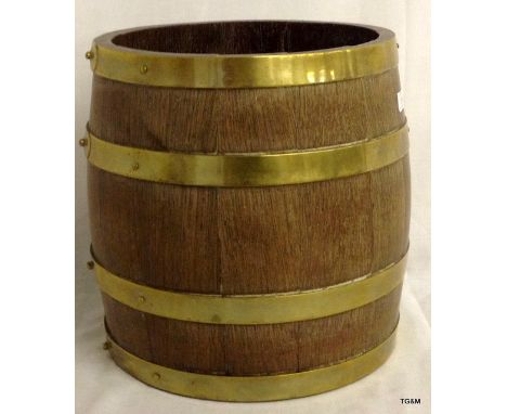 A wooden Brass banded Barrel planter