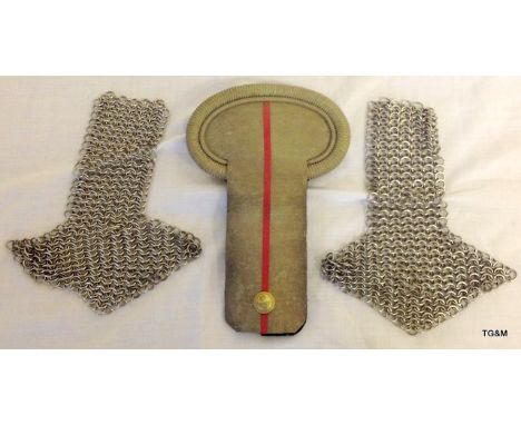 A pair of early 20th century British military chain mail epaulettes and a single French Army officers epaulette