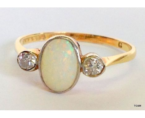 An 18ct gold Diamond and Opal ring size P