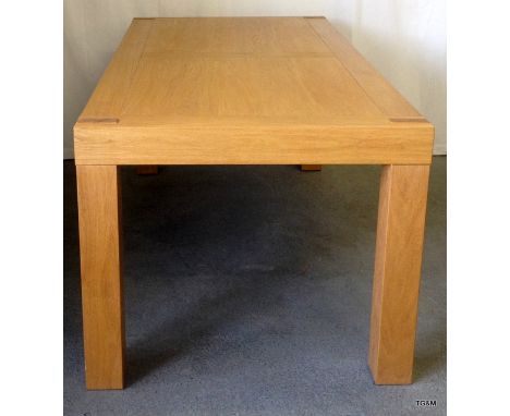 A modern solid light Oak dining table h x 65, w x 180, d x 90cm