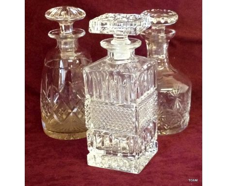 An Edinburgh crystal decanter with 2 others