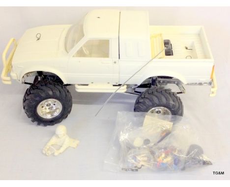 A Vintage Tamiya Bruiser R/C model complete just needs body finishing