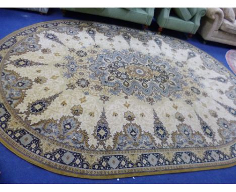 A MUSTARD GROUND PATTERNED OVAL CARPET, approximate size 350cm x 250cm, another carpet and two rugs (4)